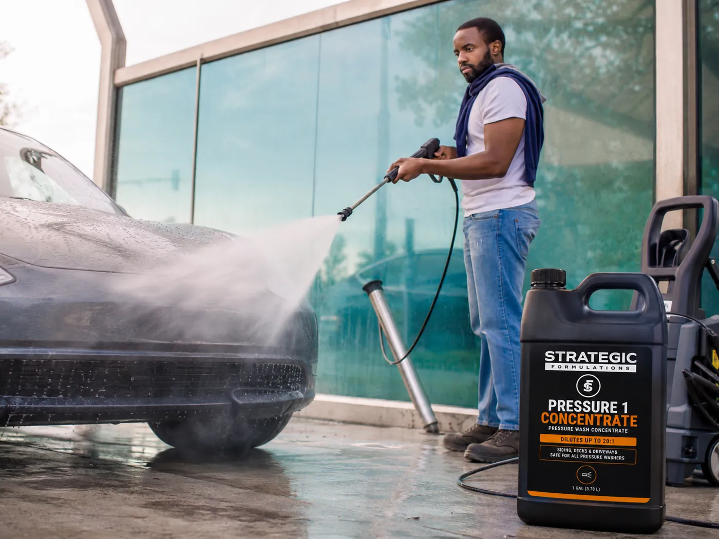 Rinsing a car top to bottom under overcast light with PRESSURE 1 CONCENTRATE